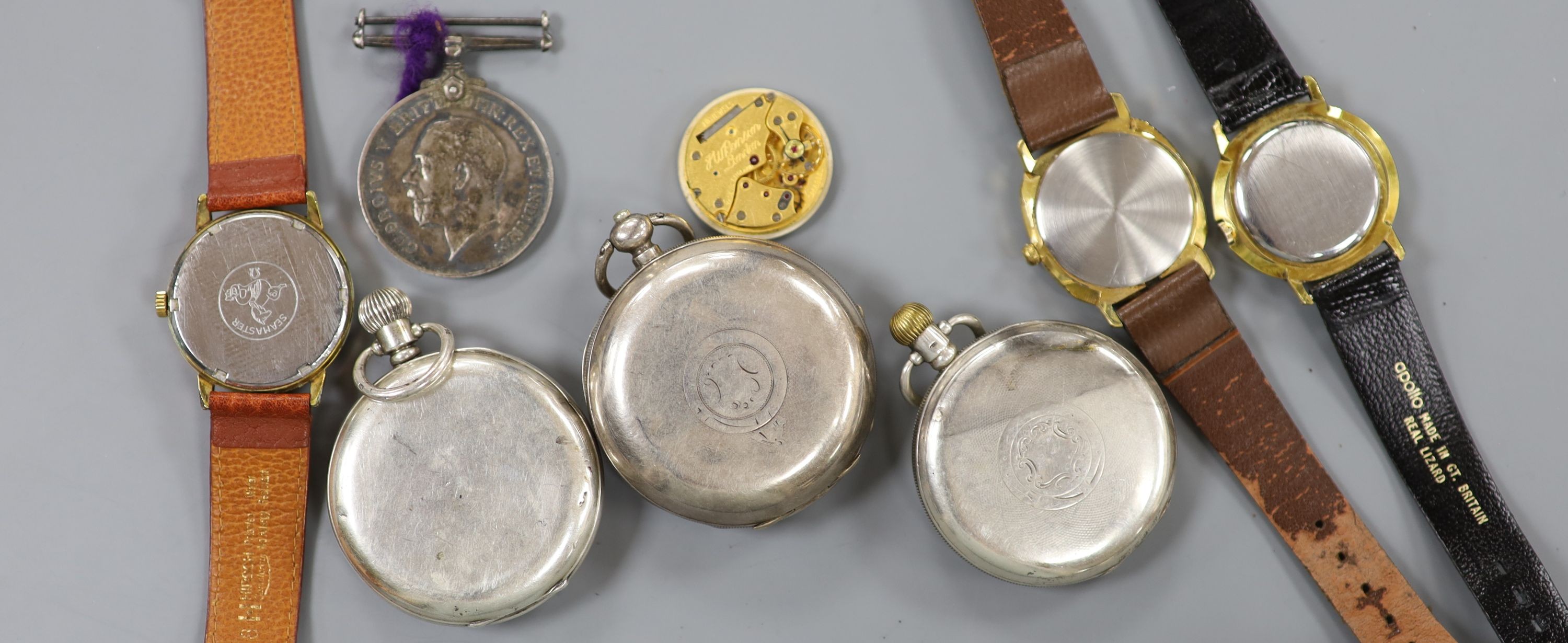 A gentleman's steel and gold plated Omega manual wind wrist watch, three other wrist watches, three pocket watches and a medal.